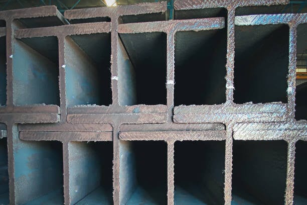 Metal profiled steel beams are packed at the metal products warehouse, H-beam steel and Wi-Frank steel. For large structures or building columns